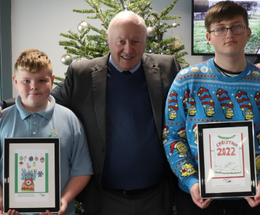 An image of council leader with two young people from Folkestone
