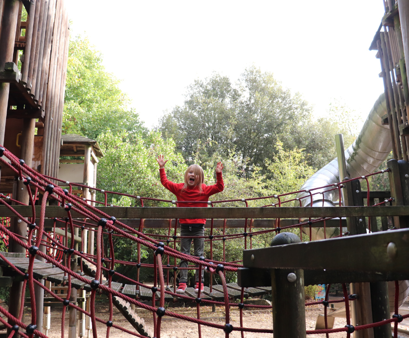 A child enjoying the existing play area equipment at the Lower Leas Coastal Park