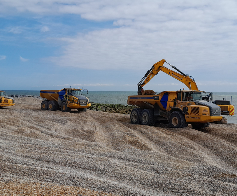 Three vehicles carrying out beach management work on the Folkestone &amp; Hythe district coast.