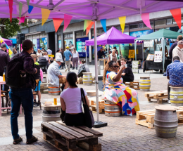 People sitting outside Folca enjoying the Folkestone Food Festival in August 2024.