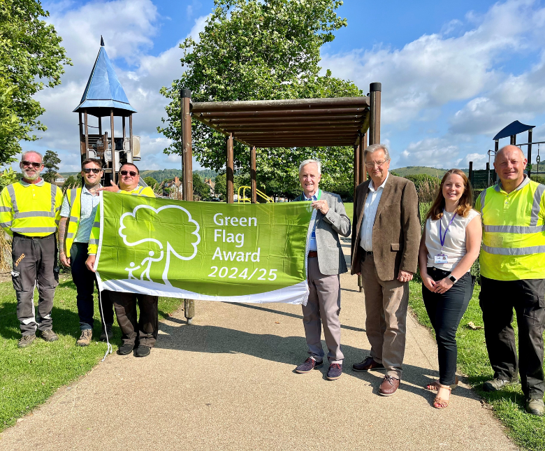 An image of council staff and councillors (left to right) Jim Martin and Jeremy Speakman at a Green Flag Award winning space, Radnor Park in Folkestone